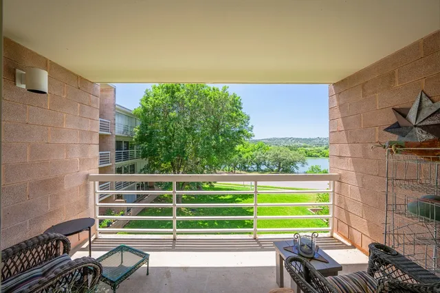 a view of a chair and table in the balcony