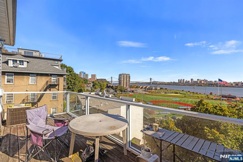 67 Highway 5 Edgewater, NJ 07020 - Photo 15 of 24 a view of a chairs and table in the terrace