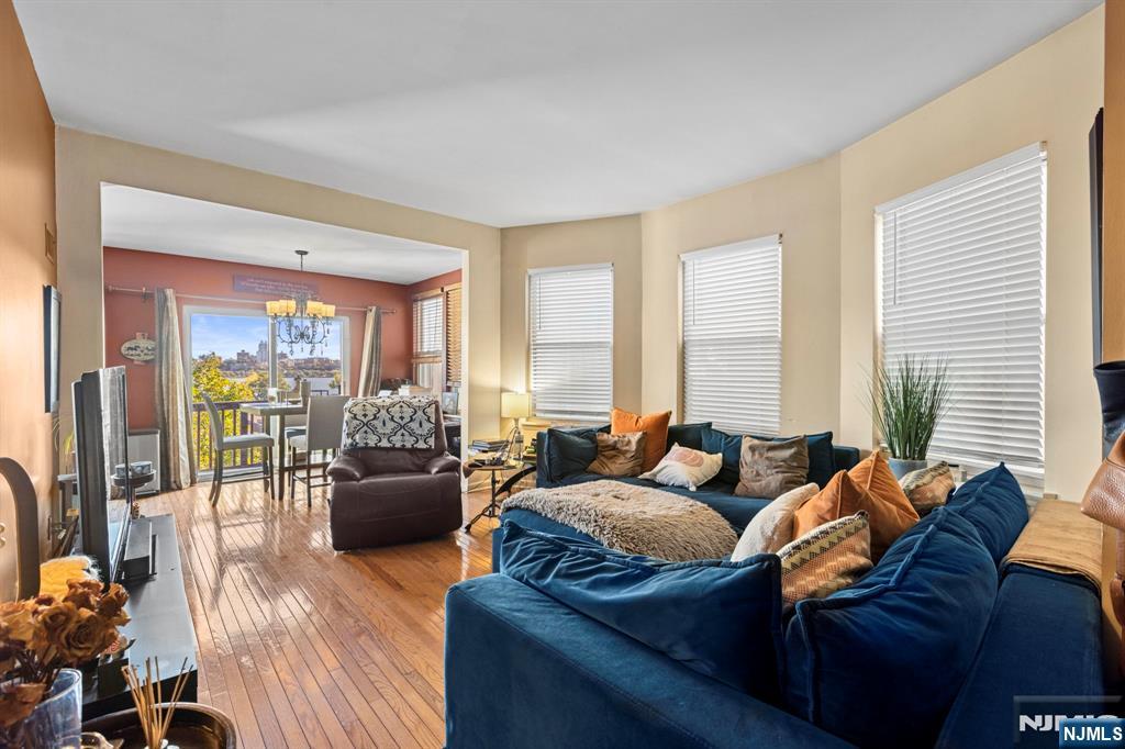 67 Highway 5 Edgewater, NJ 07020 - Photo 6 of 24 a living room with furniture and a large window