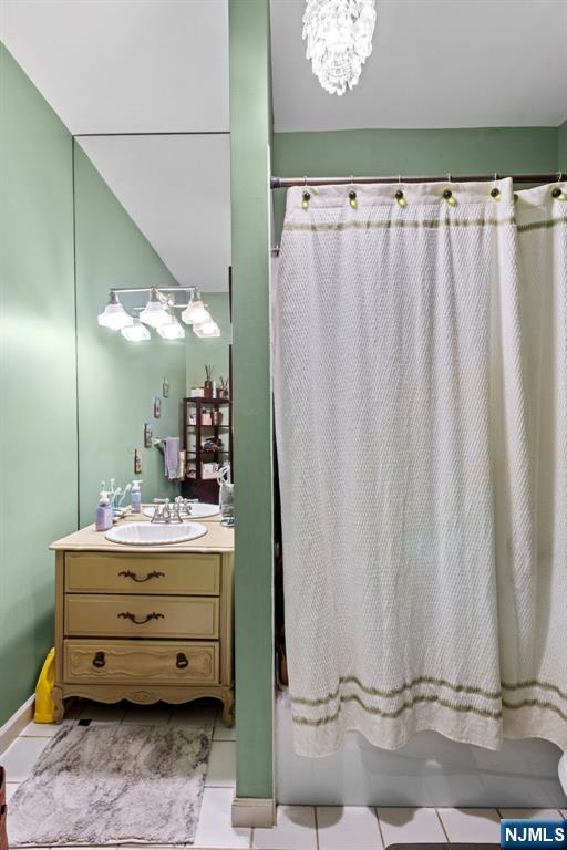 67 Highway 5 Edgewater, NJ 07020 - Photo 9 of 24 a room with a mirror and a curtain