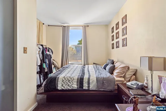 a bedroom with a bed and closet