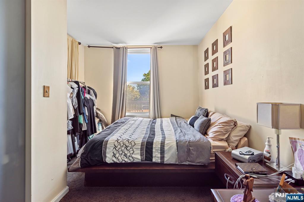 67 Highway 5 Edgewater, NJ 07020 - Photo 10 of 24 a bedroom with a bed and closet