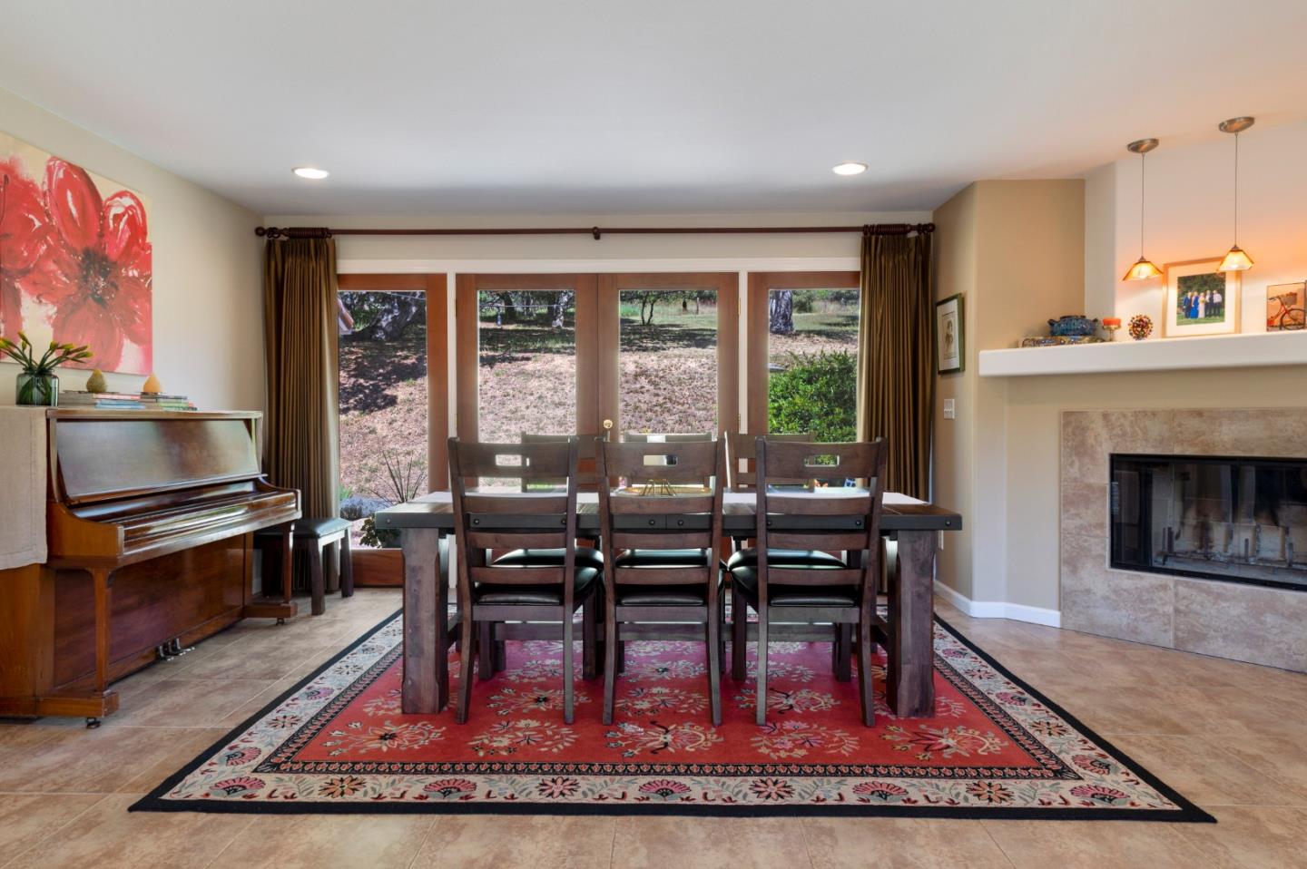 481 Maher Road Watsonville, CA 95076 - Photo 17 of 34 a living room with furniture a rug wooden floor and a fireplace