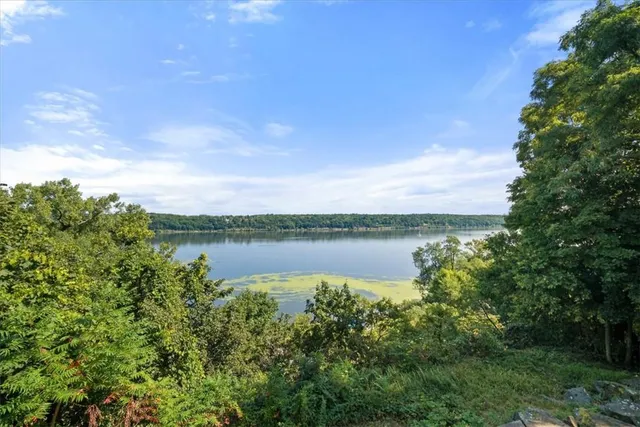 a view of lake with green space