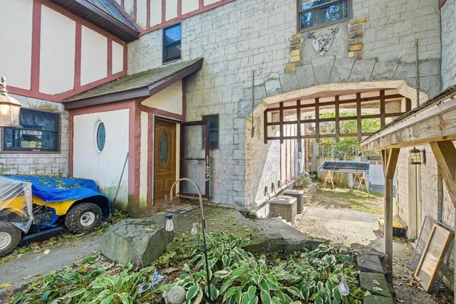 a view of a porch with hardwood floor and a outdoor space