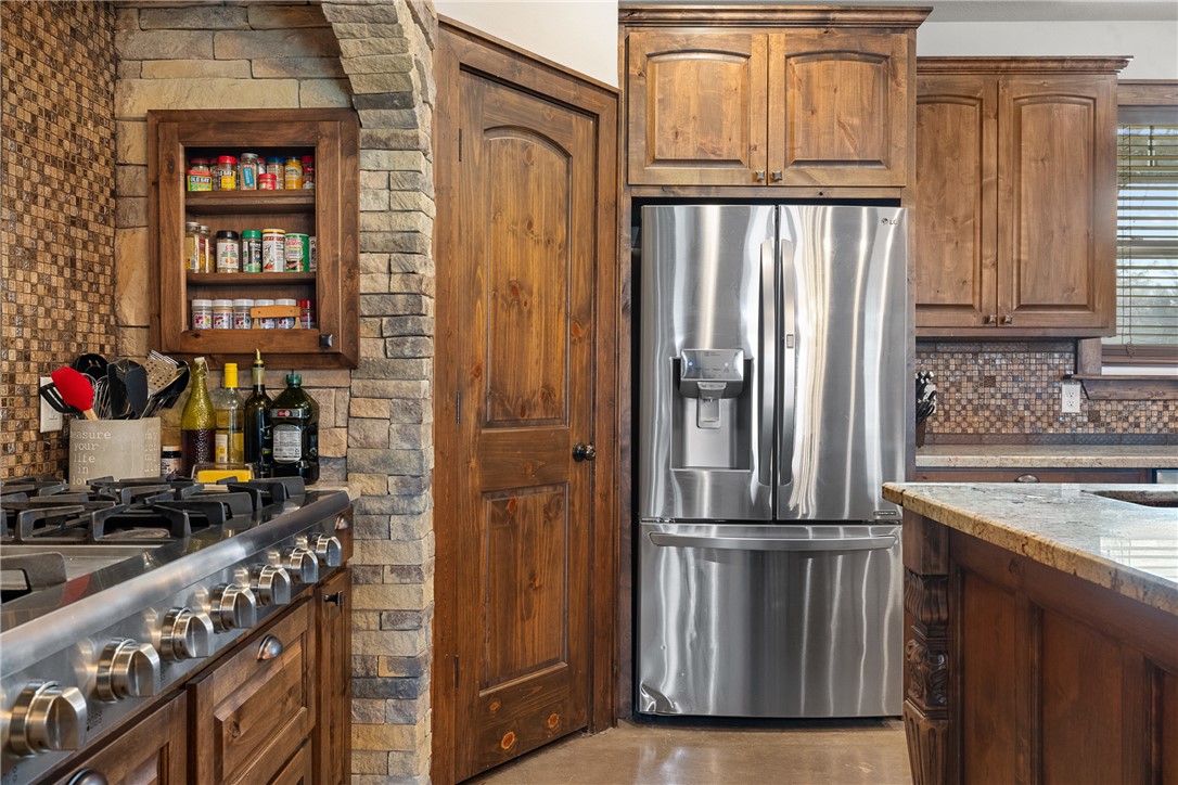 7440 Fm 39 Road South North Zulch, TX 77872 - Photo 16 of 50 a kitchen with a refrigerator and a sink