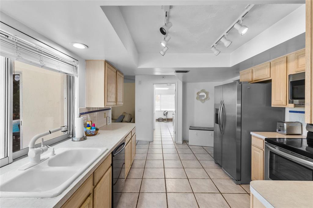 433 Whitfield Avenue Sarasota, FL 34243 - Photo 18 of 46 a bathroom with a sink double vanity and a large mirror