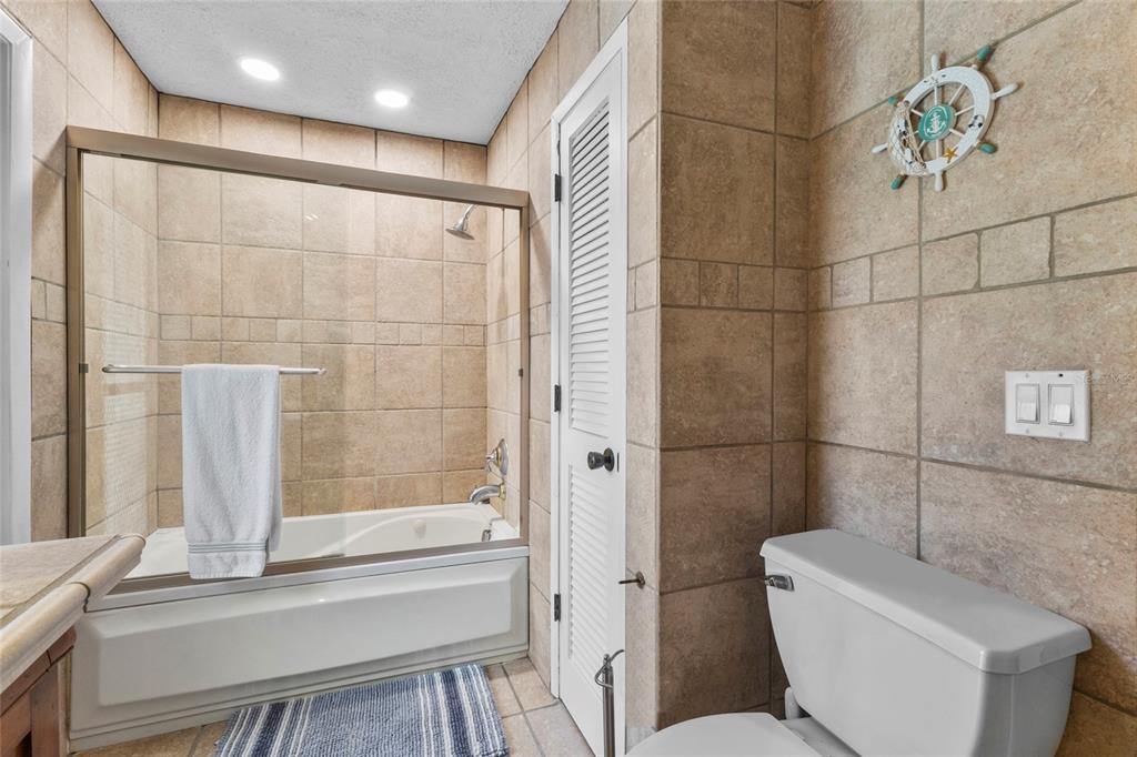 433 Whitfield Avenue Sarasota, FL 34243 - Photo 31 of 46 a bathroom with a bathtub and a toilet