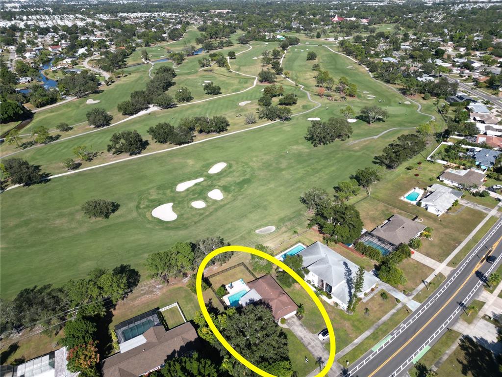 433 Whitfield Avenue Sarasota, FL 34243 - Photo 4 of 46 an aerial view of a swimming pool yard and outdoor seating