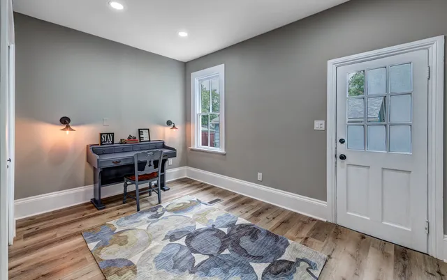 a workspace with furniture and window