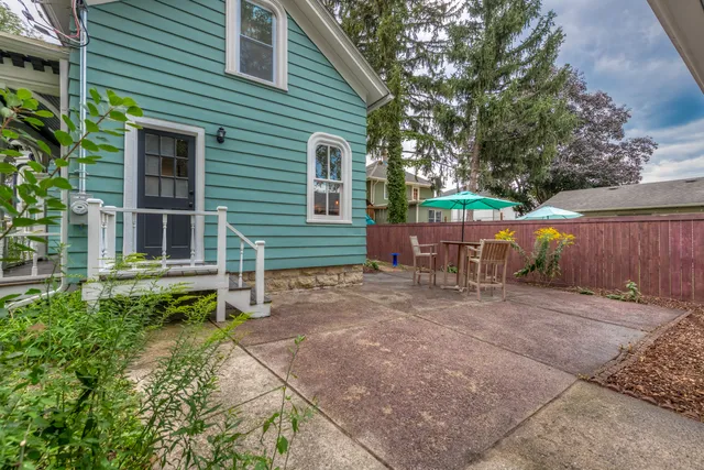 a view of an outdoor sitting area with brick walls
