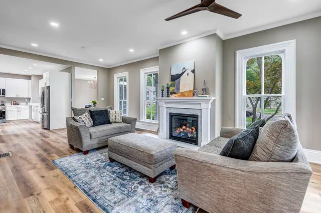 a living room with furniture and a fireplace