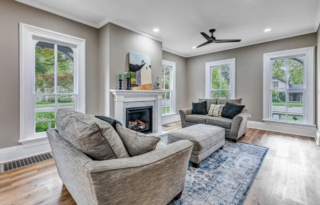a living room with furniture and a fireplace