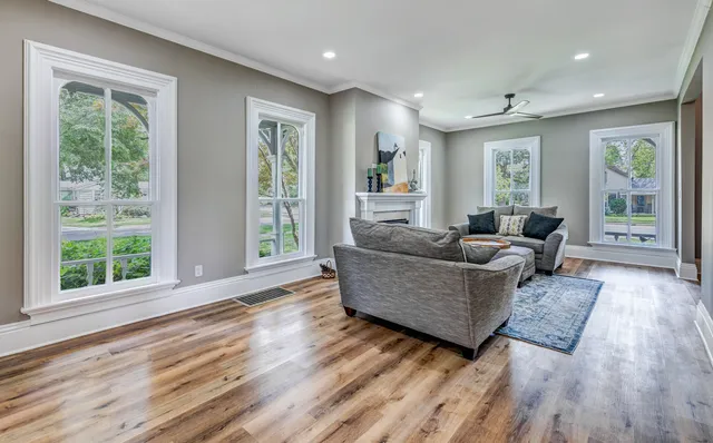 a living room with furniture and windows