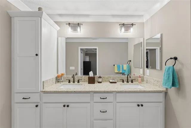 a kitchen with stainless steel appliances kitchen island granite countertop a sink and a stove