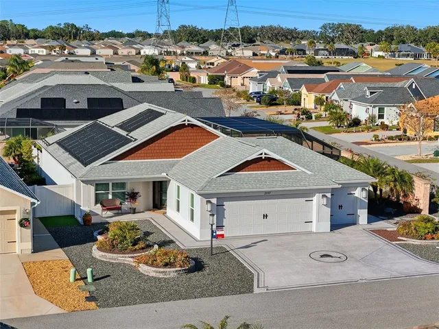a kitchen with stainless steel appliances kitchen island granite countertop a sink a stove and a wooden floors