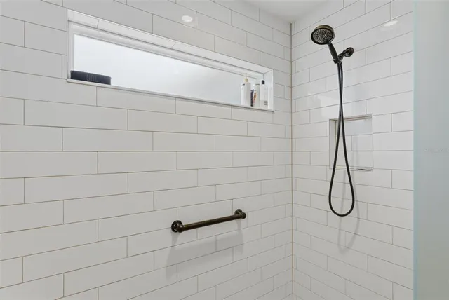 a view of a room with wooden floor and windows