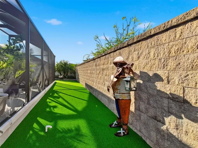 a living room with furniture ceiling fan and a flat screen tv
