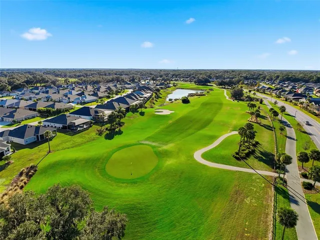 an aerial view of a house with outdoor space