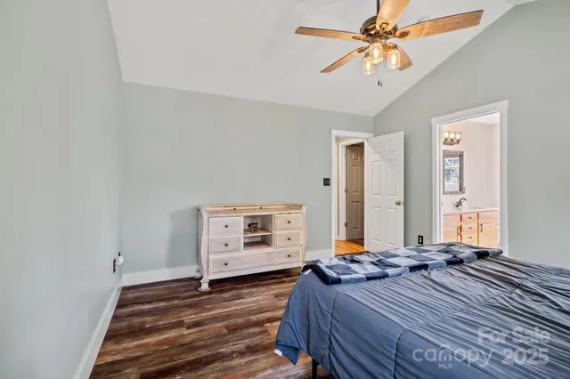 a bed room with a bed and a chandelier
