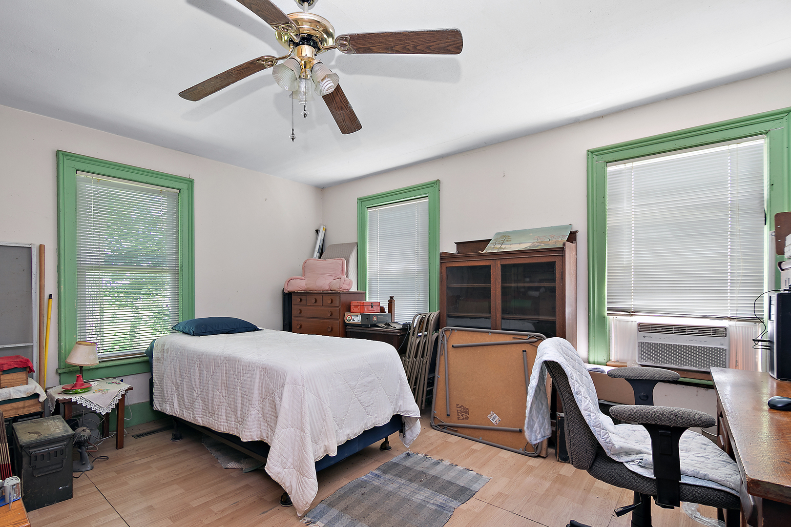 1757 East 3000 North Road Martinton, IL 60951 - Photo 11 of 33 a bedroom with a bed wooden floor and windows