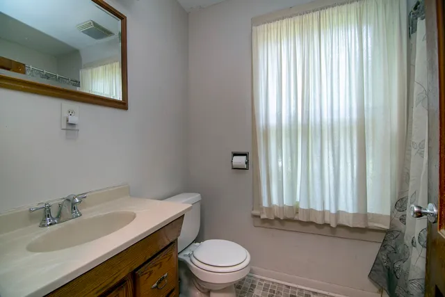 a bathroom with a sink a toilet and tub