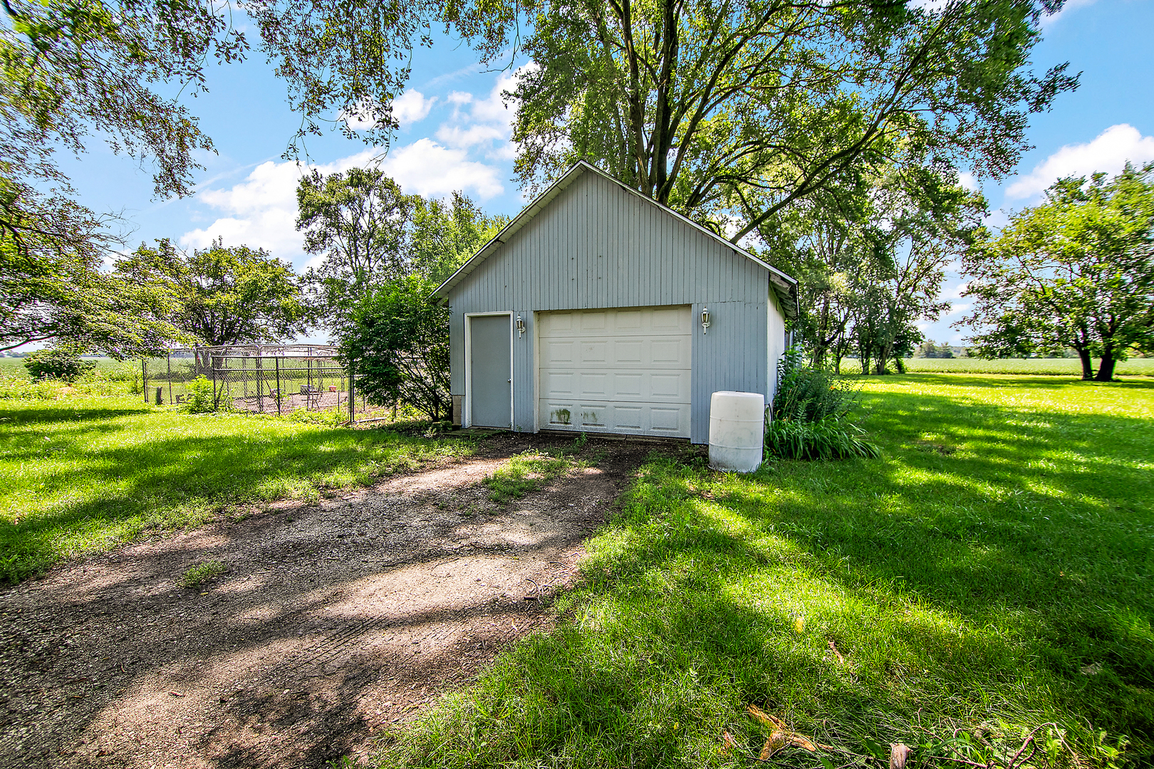 1757 East 3000 North Road Martinton, IL 60951 - Photo 17 of 33 a house that is sitting in middle of the forest
