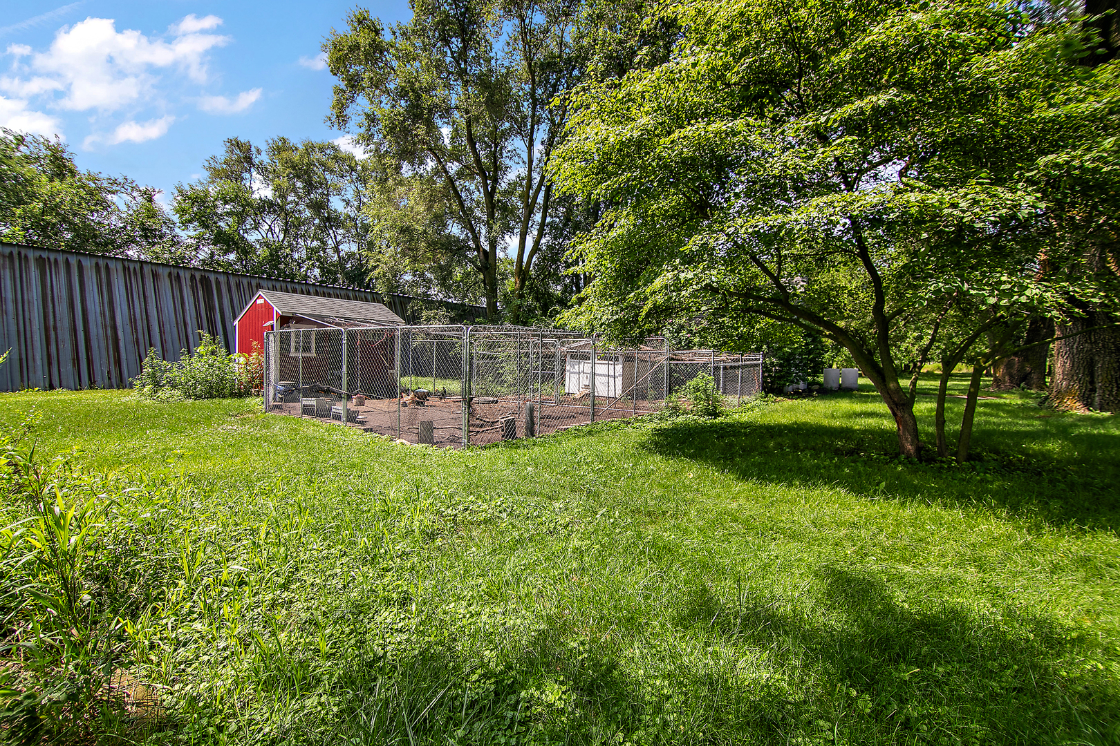 1757 East 3000 North Road Martinton, IL 60951 - Photo 19 of 33 a front view of a house with garden and trees
