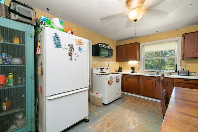 a white refrigerator freezer sitting in a kitchen