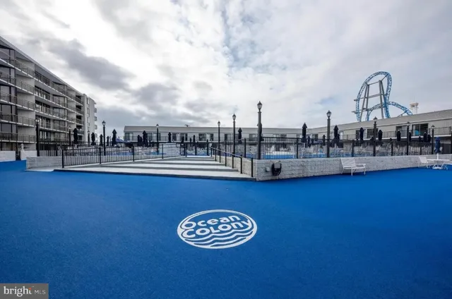 a view of a swimming pool with an outdoor seating