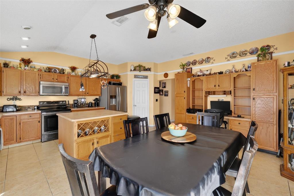 562 Hassocks Loop Lake Mary, FL 32746 - Photo 14 of 34 a large kitchen with a table and chairs