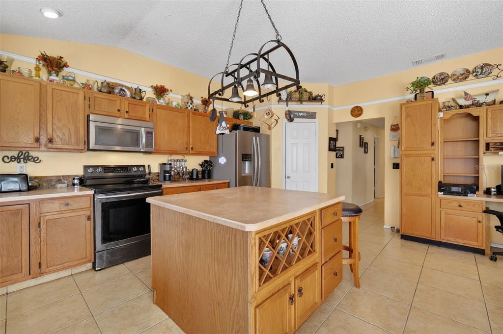 562 Hassocks Loop Lake Mary, FL 32746 - Photo 15 of 34 a kitchen that has a lot of cabinets in it