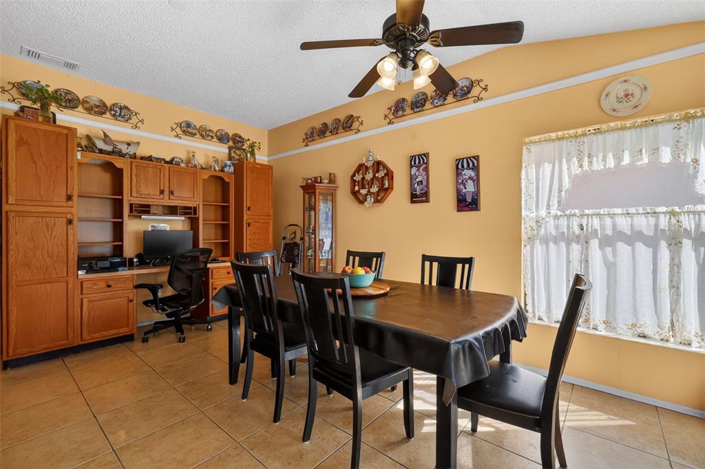 562 Hassocks Loop Lake Mary, FL 32746 - Photo 16 of 34 a view of a dining room with furniture and a window