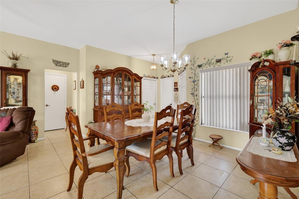 562 Hassocks Loop Lake Mary, FL 32746 - Photo 17 of 34 a view of a dining room with furniture and chandelier