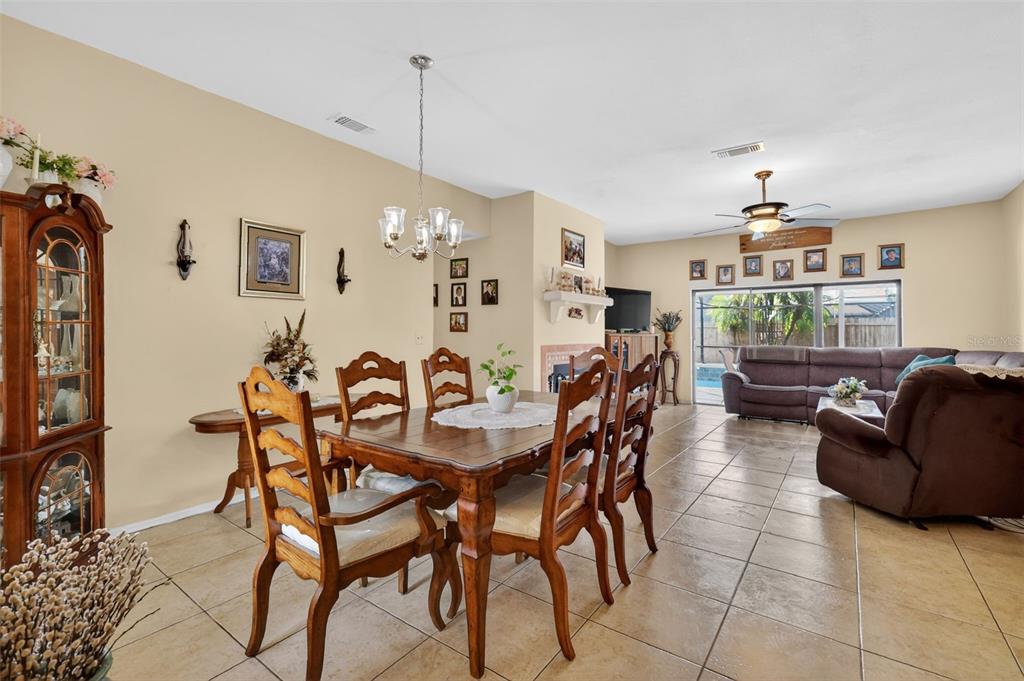 562 Hassocks Loop Lake Mary, FL 32746 - Photo 21 of 34 a view of a dining room with furniture and chandelier