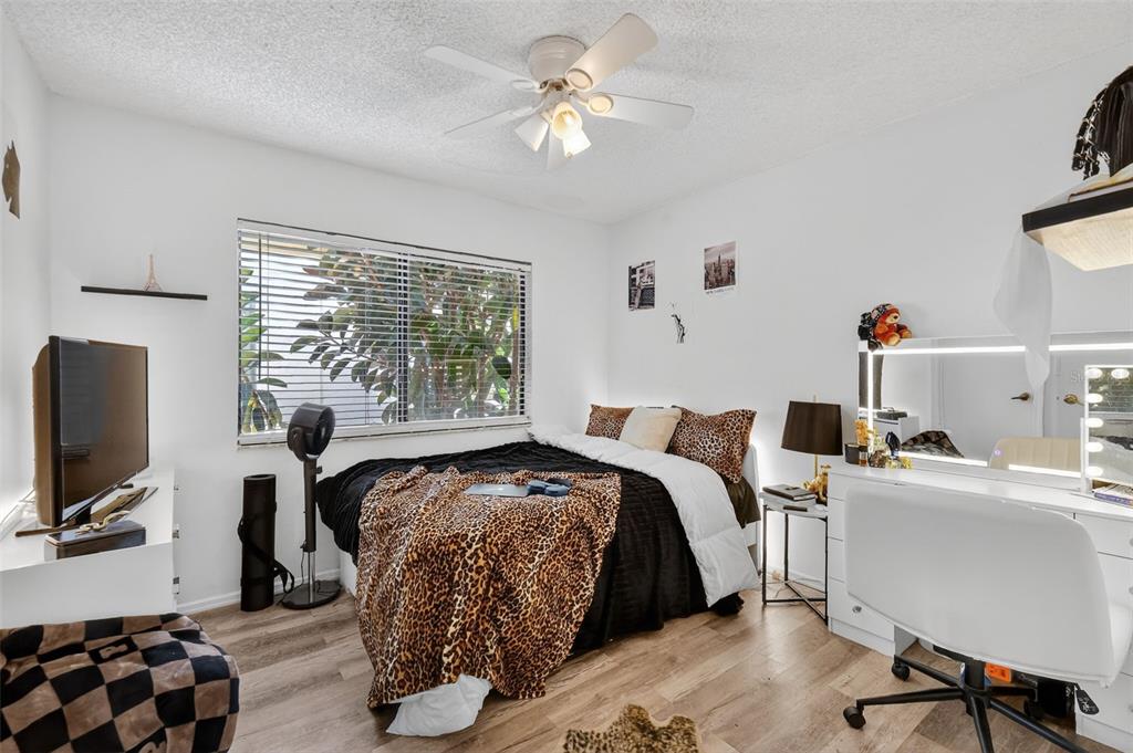 562 Hassocks Loop Lake Mary, FL 32746 - Photo 27 of 34 a bedroom with a bed and a flat screen tv