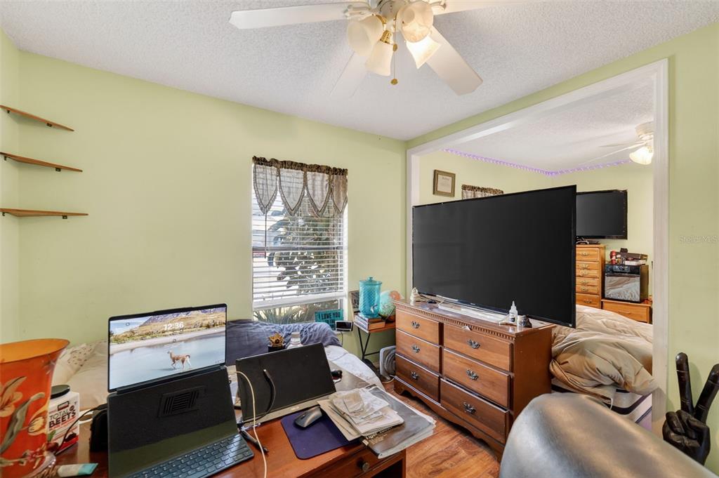 562 Hassocks Loop Lake Mary, FL 32746 - Photo 30 of 34 a living room with furniture and a flat screen tv