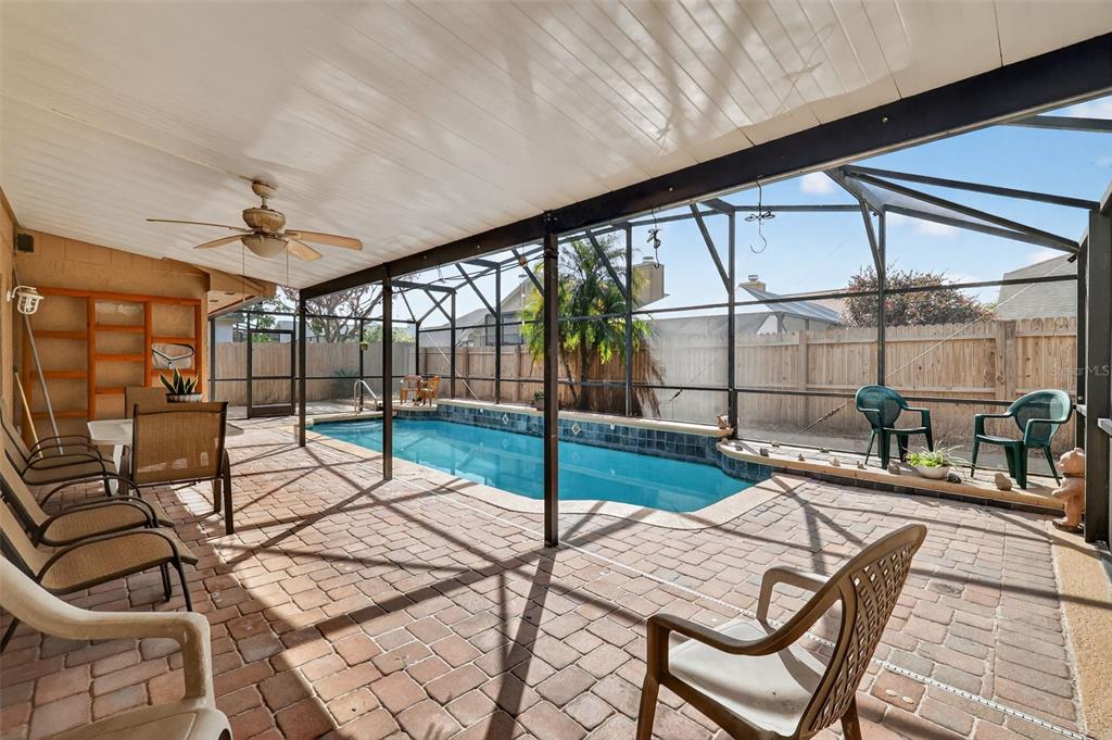 562 Hassocks Loop Lake Mary, FL 32746 - Photo 5 of 34 a living room with a floor to ceiling window and a table