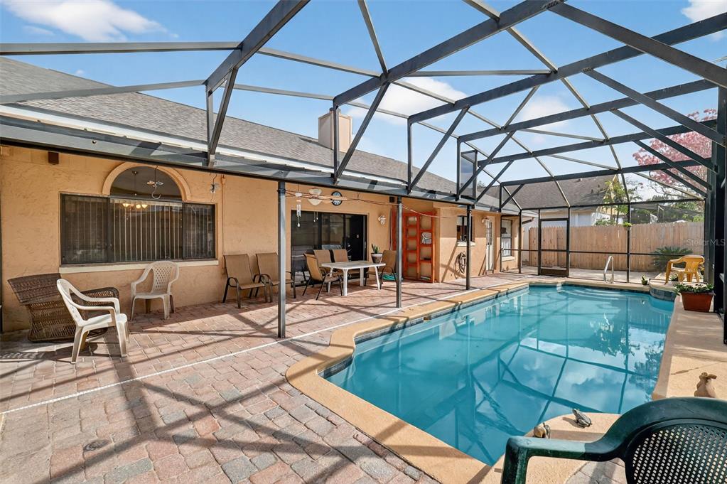 562 Hassocks Loop Lake Mary, FL 32746 - Photo 6 of 34 a view of a patio with table and chairs and potted plants