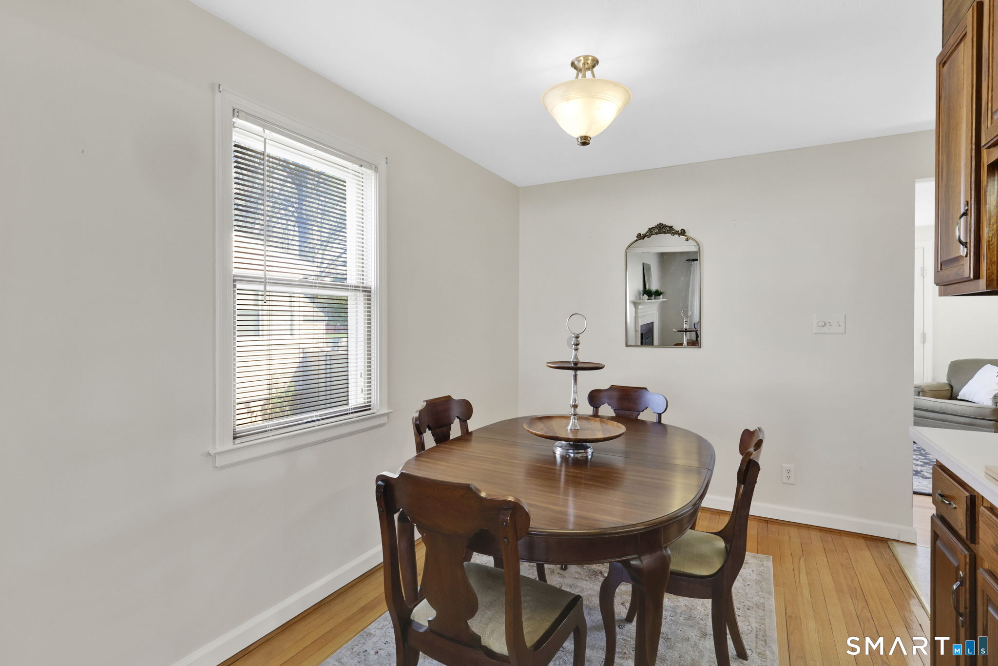 24 Madsen Road West Hartford, CT 06110 - Photo 12 of 38 a view of a dining room with furniture and wooden floor