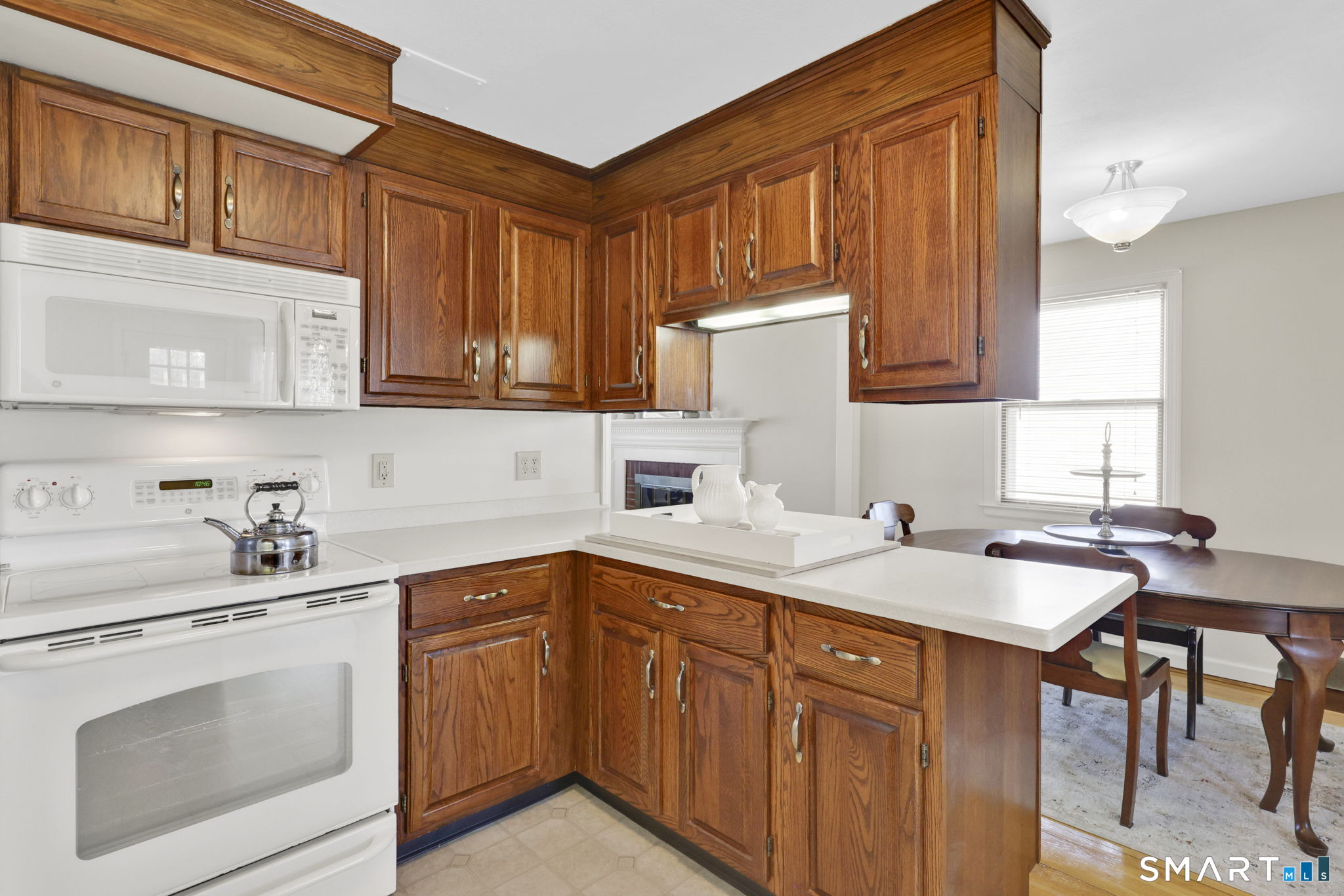 24 Madsen Road West Hartford, CT 06110 - Photo 15 of 38 a kitchen with stainless steel appliances granite countertop a sink stove and cabinets