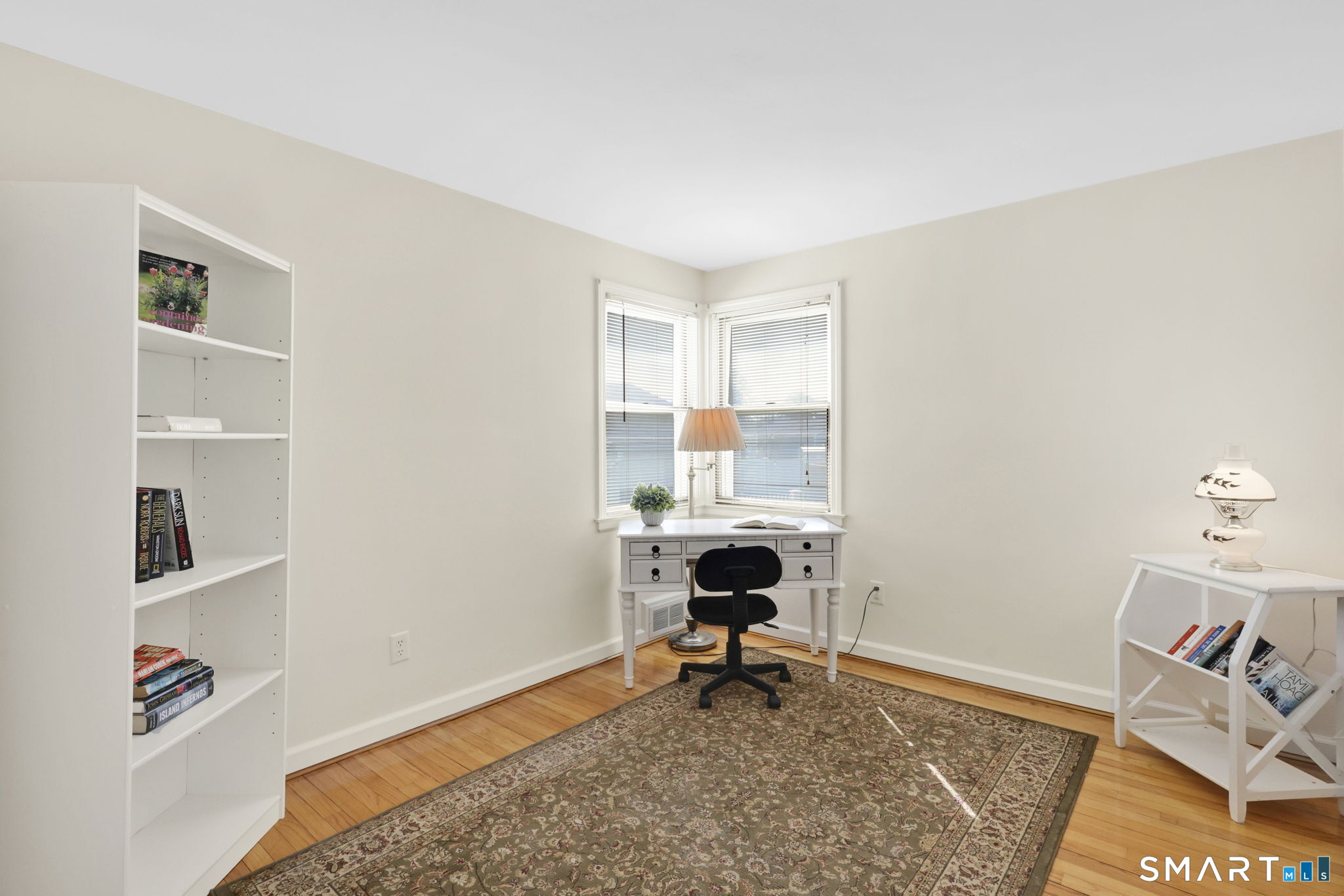 24 Madsen Road West Hartford, CT 06110 - Photo 20 of 38 a living room with furniture and a rug