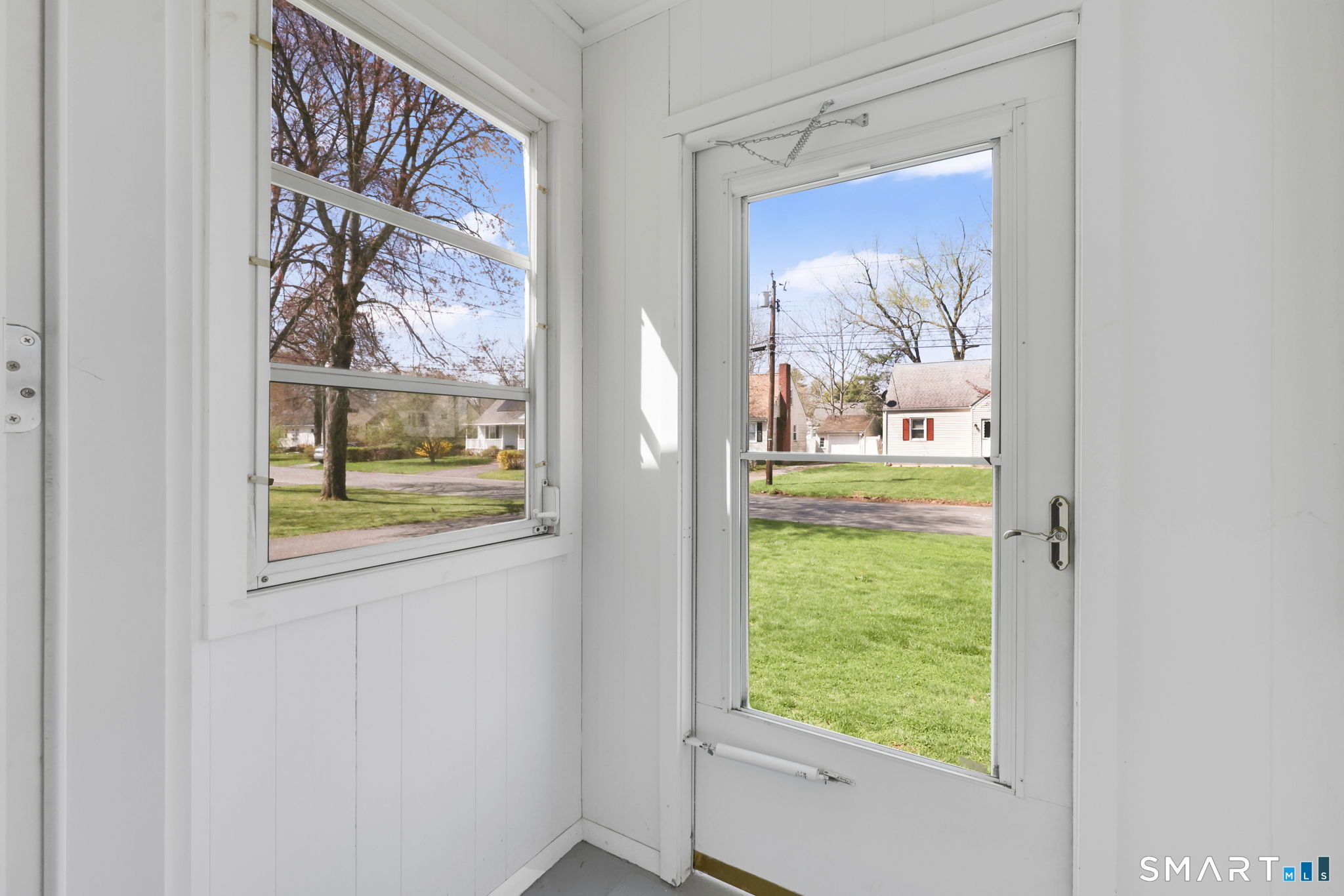 24 Madsen Road West Hartford, CT 06110 - Photo 2 of 38 a view of a hallway with a painting on the wall