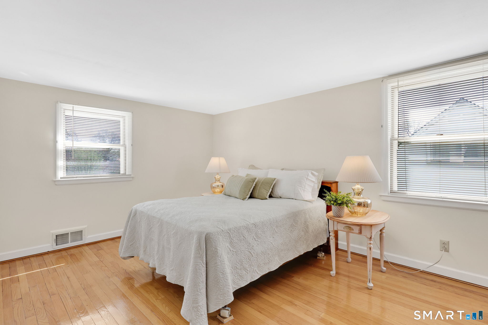 24 Madsen Road West Hartford, CT 06110 - Photo 24 of 38 a bedroom with a bed table and window