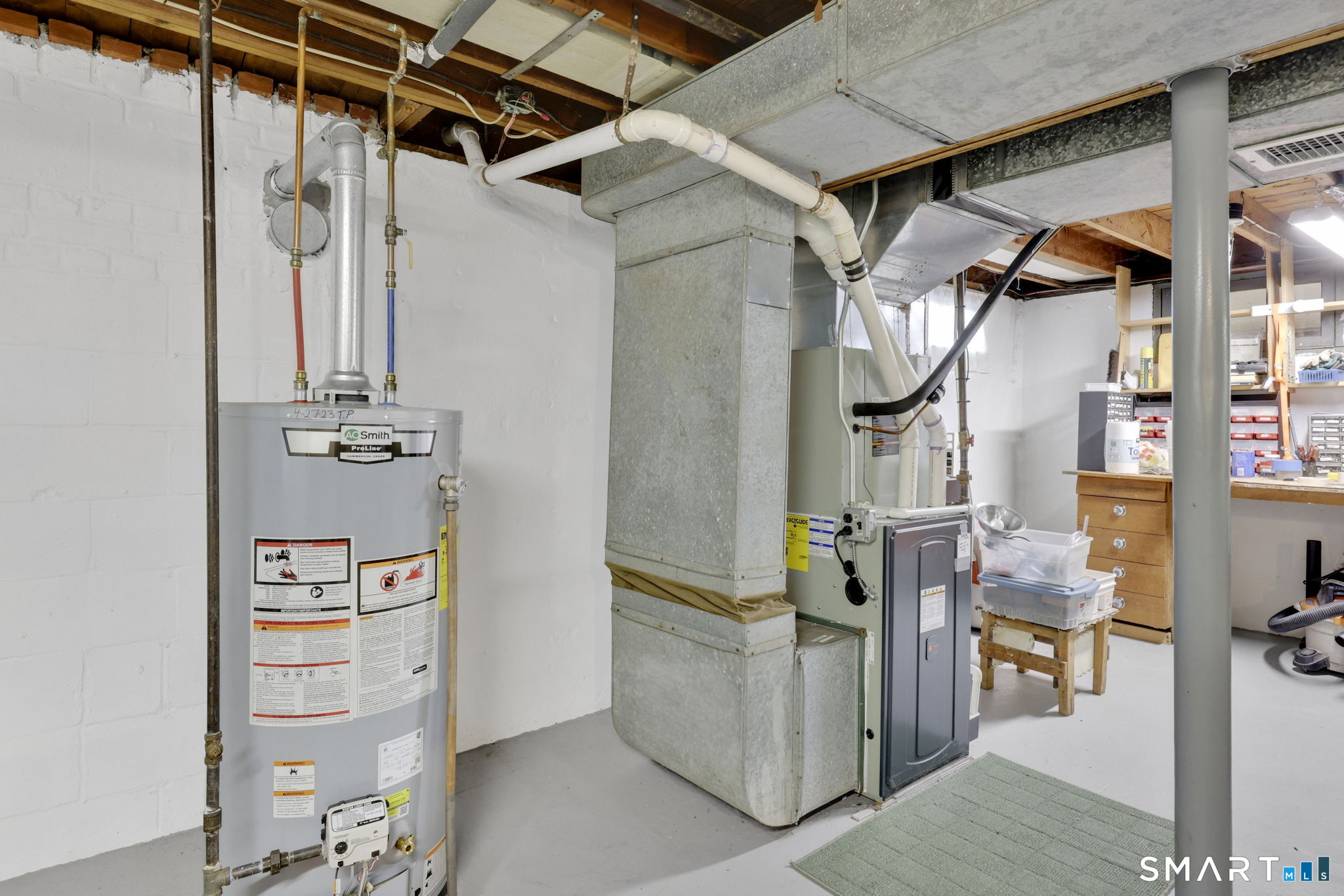 24 Madsen Road West Hartford, CT 06110 - Photo 30 of 38 a view of walk in closet with clothes and shoes