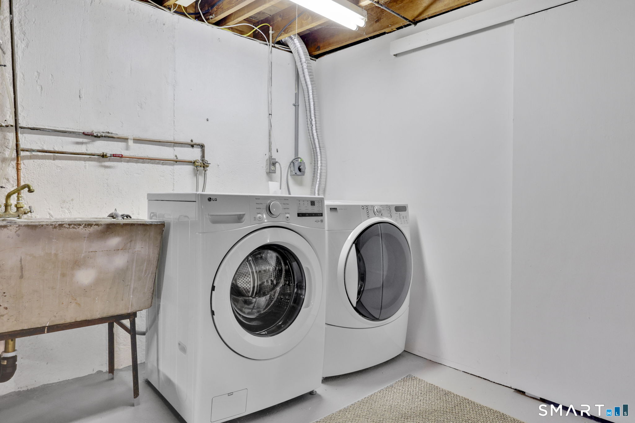 24 Madsen Road West Hartford, CT 06110 - Photo 31 of 38 a utility room with dryer and washer