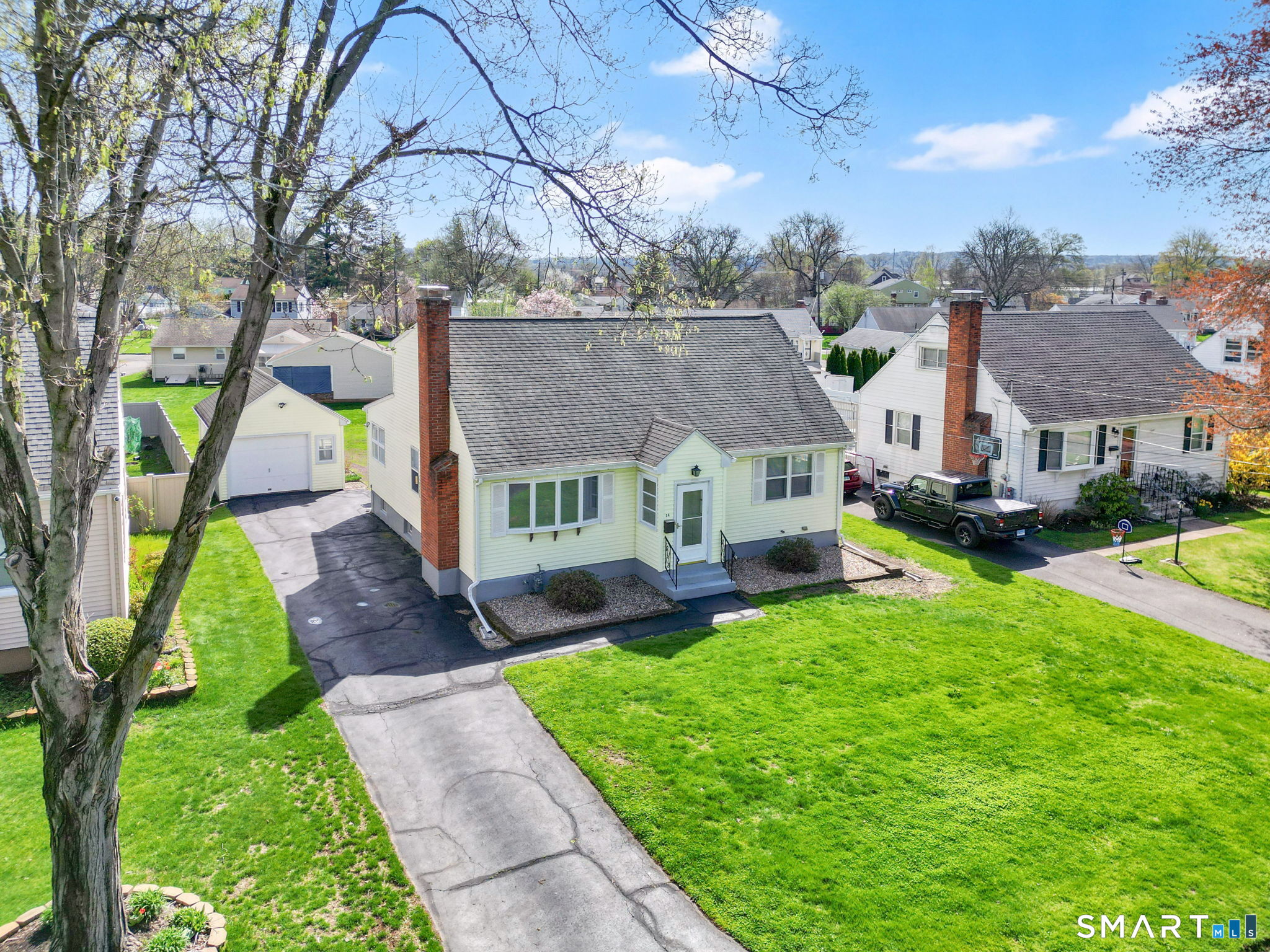 24 Madsen Road West Hartford, CT 06110 - Photo 35 of 38 a front view of house with yard and green space