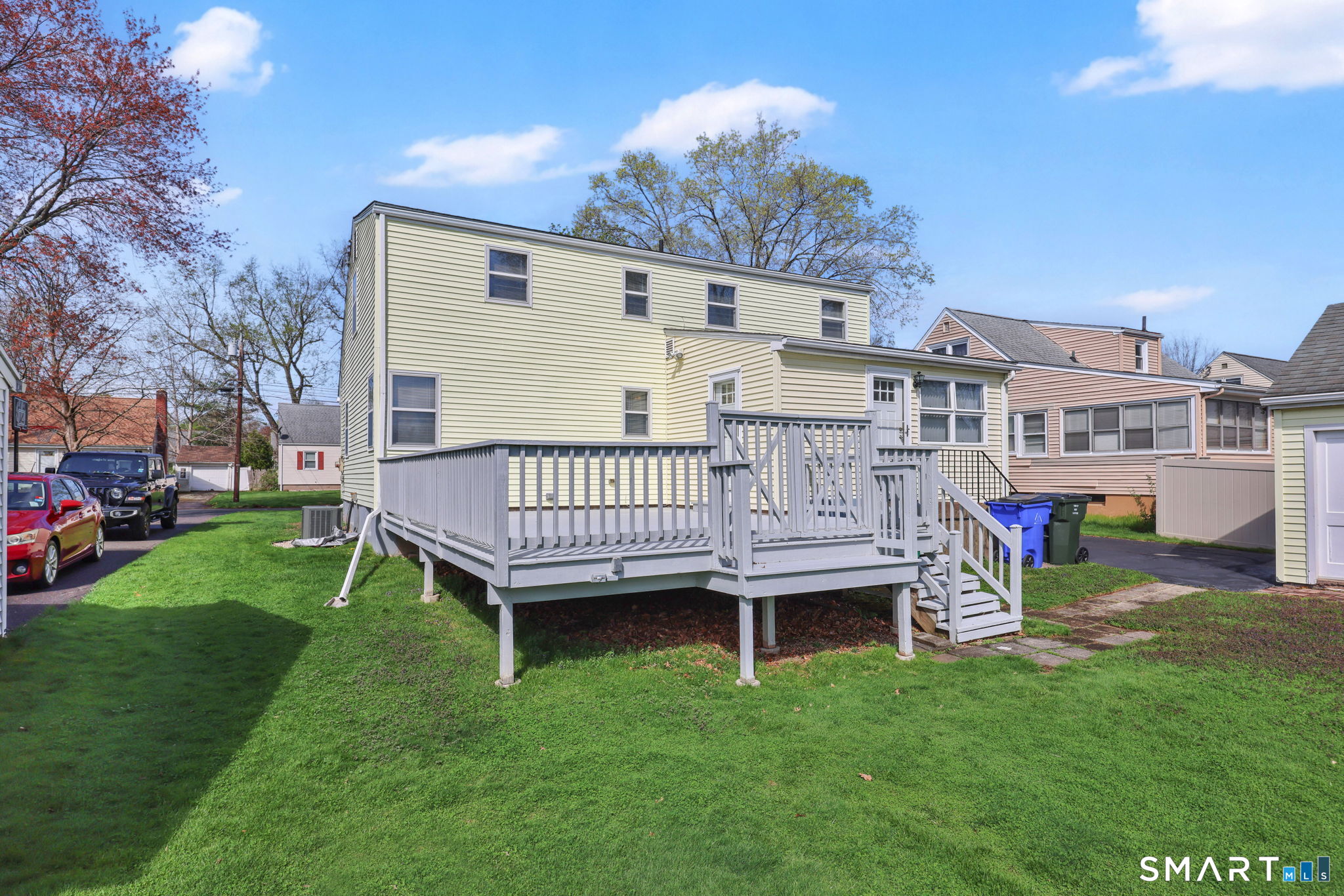 24 Madsen Road West Hartford, CT 06110 - Photo 4 of 38 a view of a house with a backyard and a patio