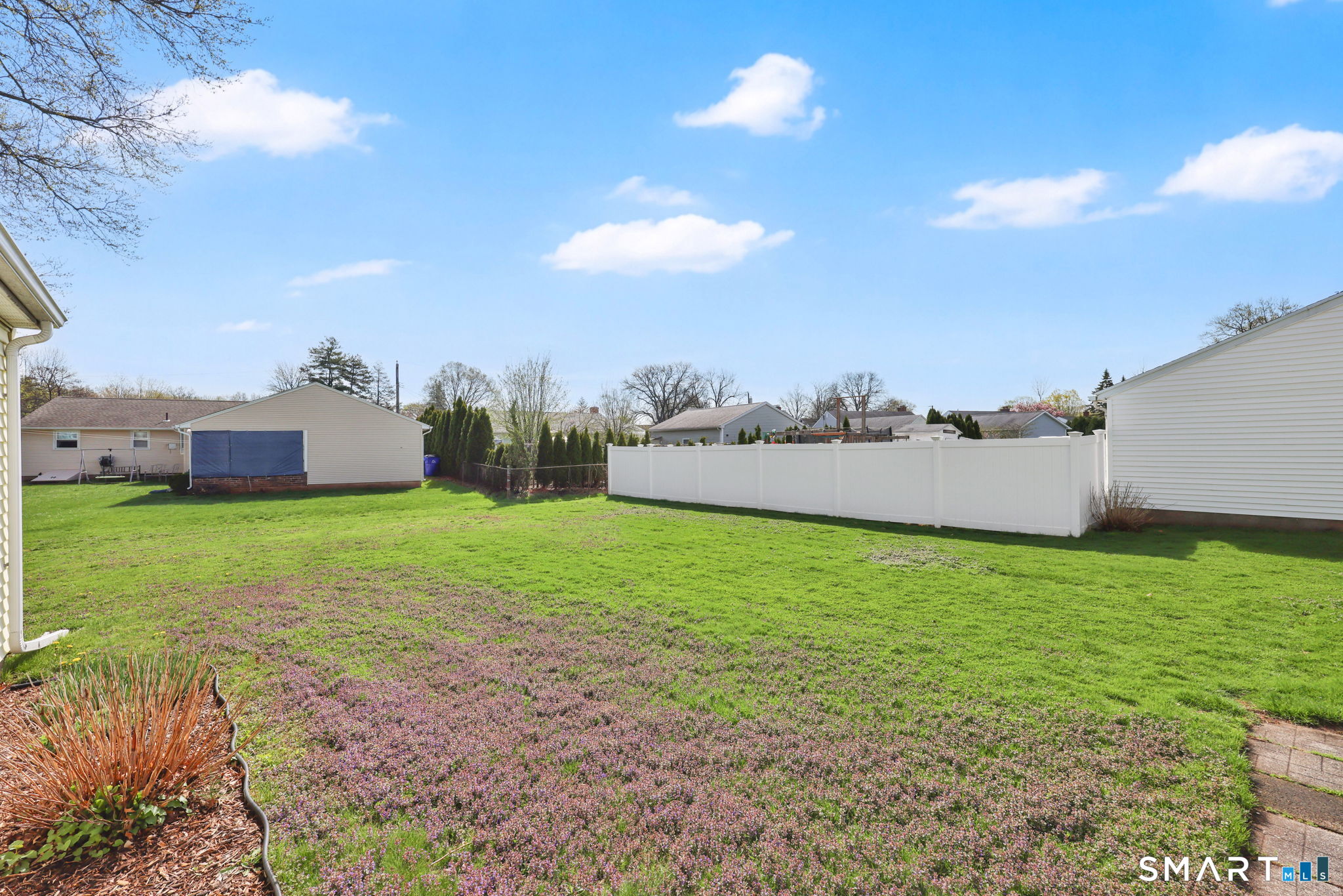 24 Madsen Road West Hartford, CT 06110 - Photo 6 of 38 a backyard of a house with lots of green space and mountain view in back