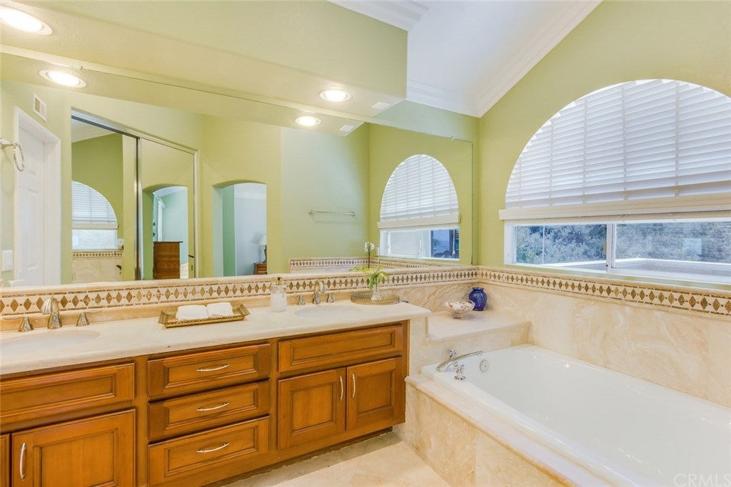 30 Santa Clara San Clemente, CA 92672 - Photo 18 of 31 Luxurious Master Bath with dual vanities and lots of natural light and ocean and canyon views.